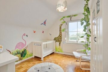 Flamingo en giraffe muurschildering